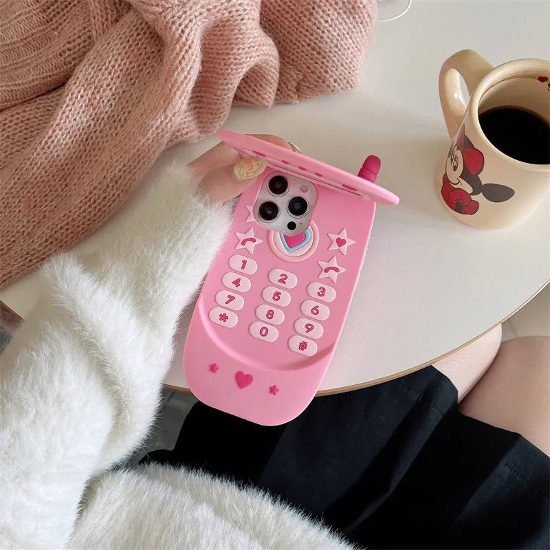Light pink silicone flip phone case for iPhone with a built-in mirror on the front.