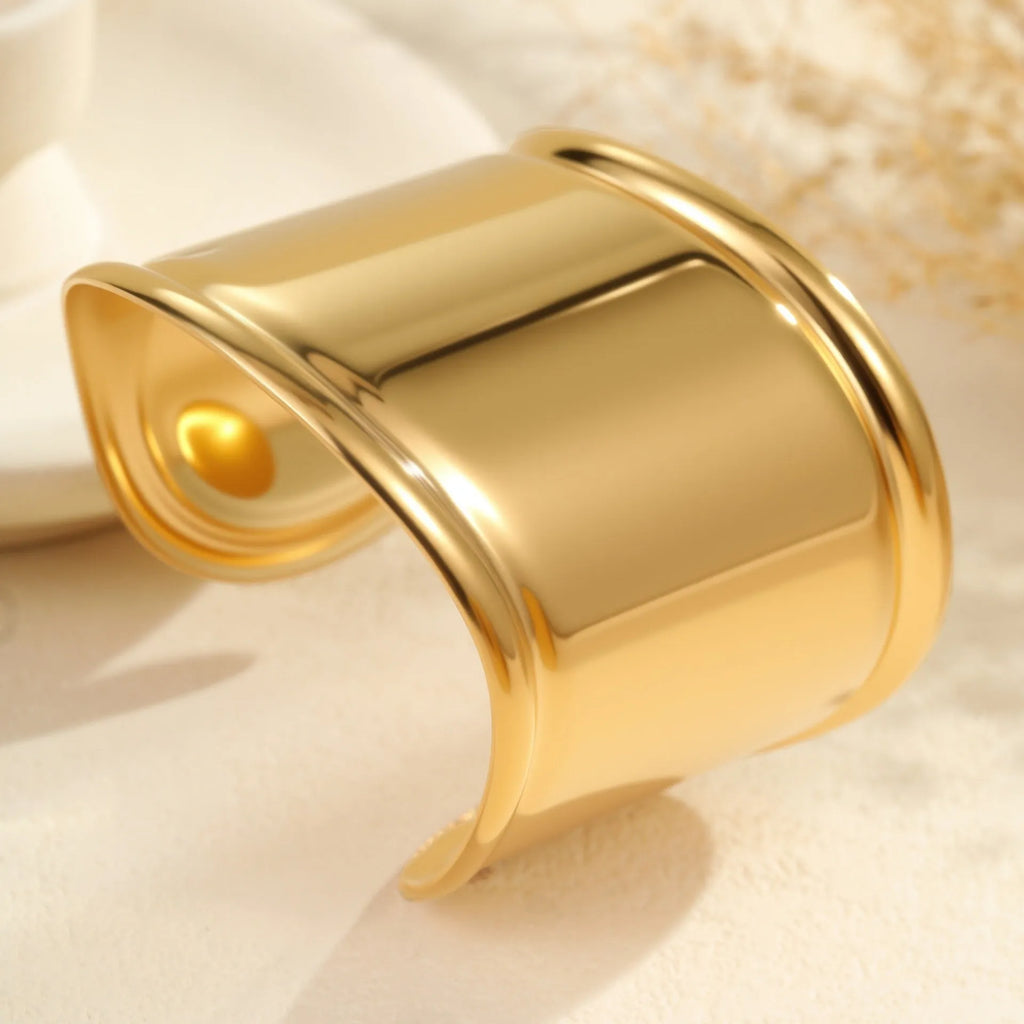 Women's gold plated stainless steel bracelet with geometric wave design and niche opening fastening