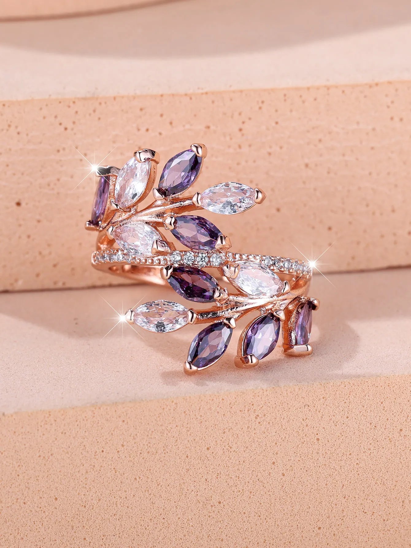 Adjustable copper leaf ring with zircon stones in various colour settings including platinum and rose gold options