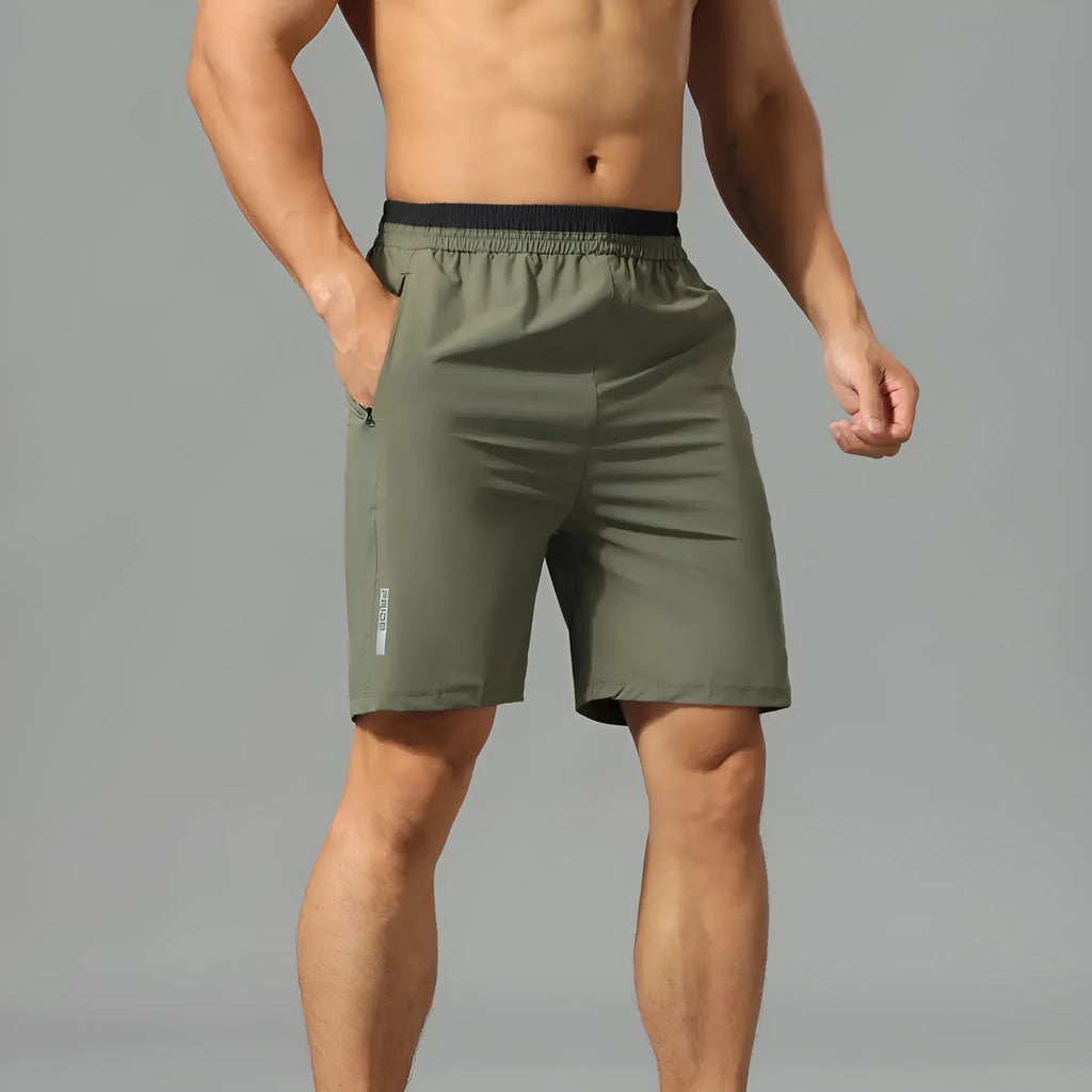 Men's Ice Silk quick-drying loose cropped running pants in army green on a model