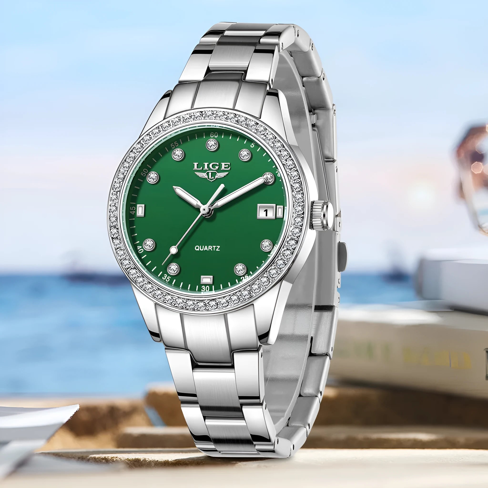 Silver stainless steel fashion quartz watch with diamond accents on dial, showing luminous markers.