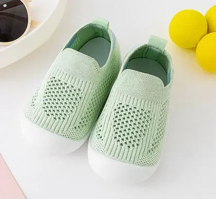 Baby soft sole non-slip walking shoes in cream yellow with fly woven cotton upper and natural rubber sole