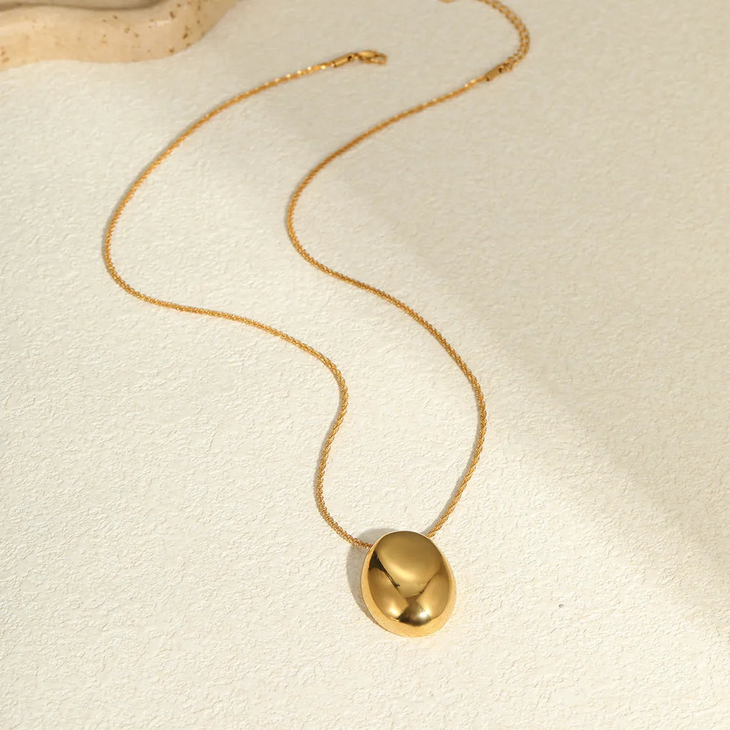 18K gold-plated geometric pendant on an adjustable stainless steel necklace chain.