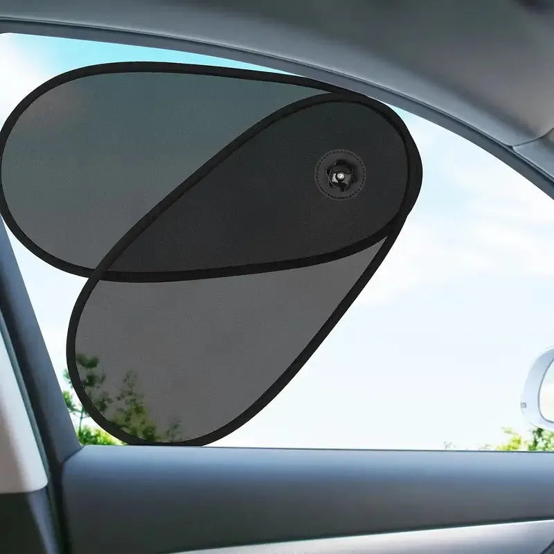 Black stretchy car window shade for baby with suction cups attached to a car side window