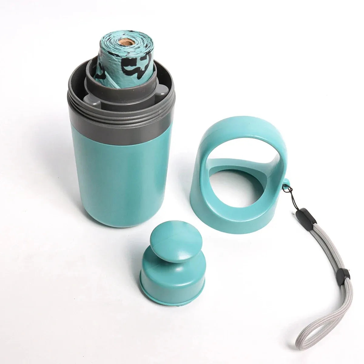 Blue dog pooper scooper with claw mechanism and bag dispenser on grass