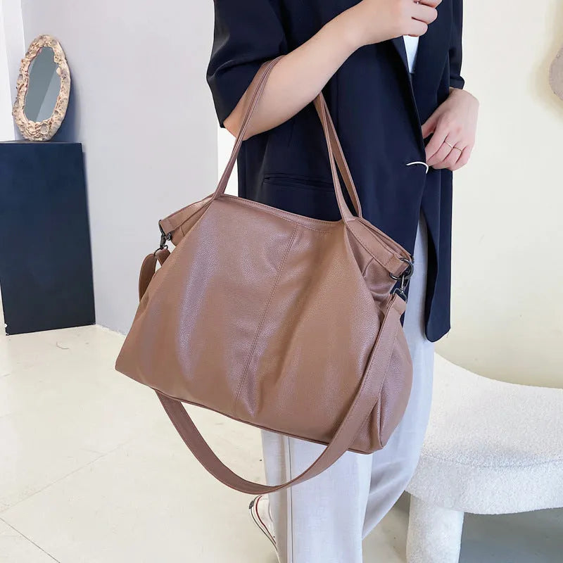 Large soft surface messenger bag with zip opening and adjustable shoulder strap in four colour options