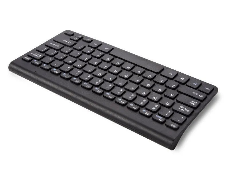 Black wireless keyboard and mouse set on wooden desk with USB receiver