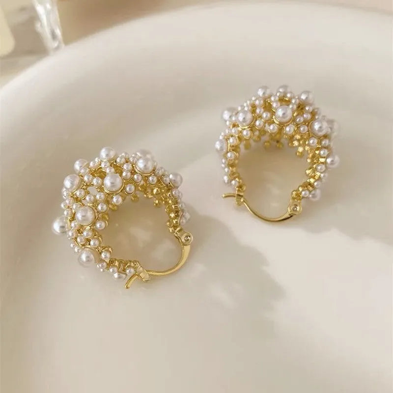 Women's gold-coloured copper flower basket earrings with small bead decoration and pearl inlay detail