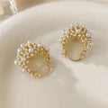 Women's gold-coloured copper flower basket earrings with small bead decoration and pearl inlay detail
