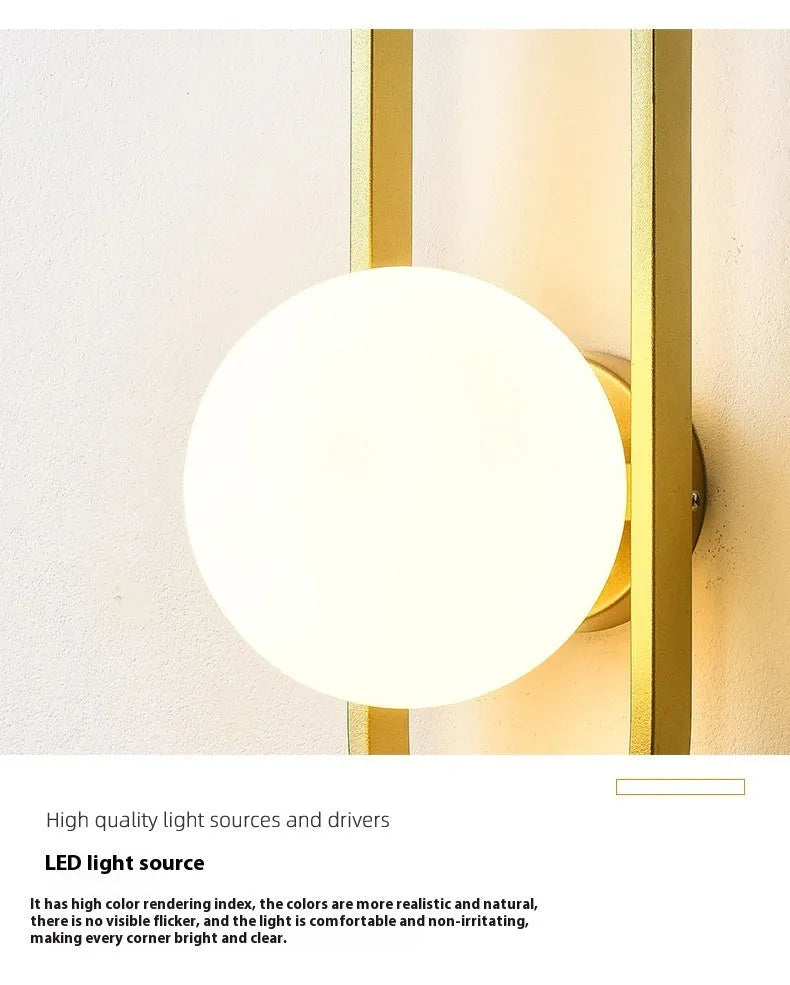 Minimalist modern wall lamp with iron body and glass shade in black or gold finish.