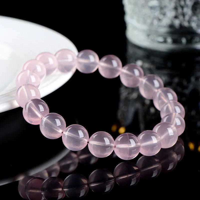 Natural starlight crystal round bead bracelet with polished finish in pink colour options