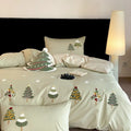Cream Blue cotton bedding set with embroidered Christmas tree and floral pattern, showing duvet cover and pillowcases.