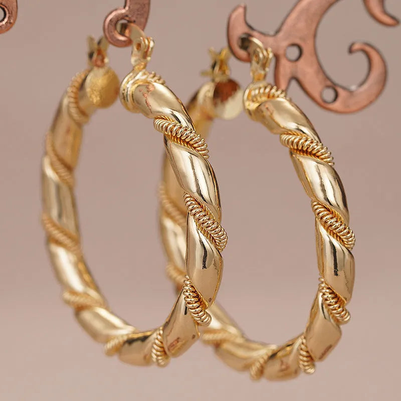 Geometric copper earrings for women with ring and line elements in golden colour