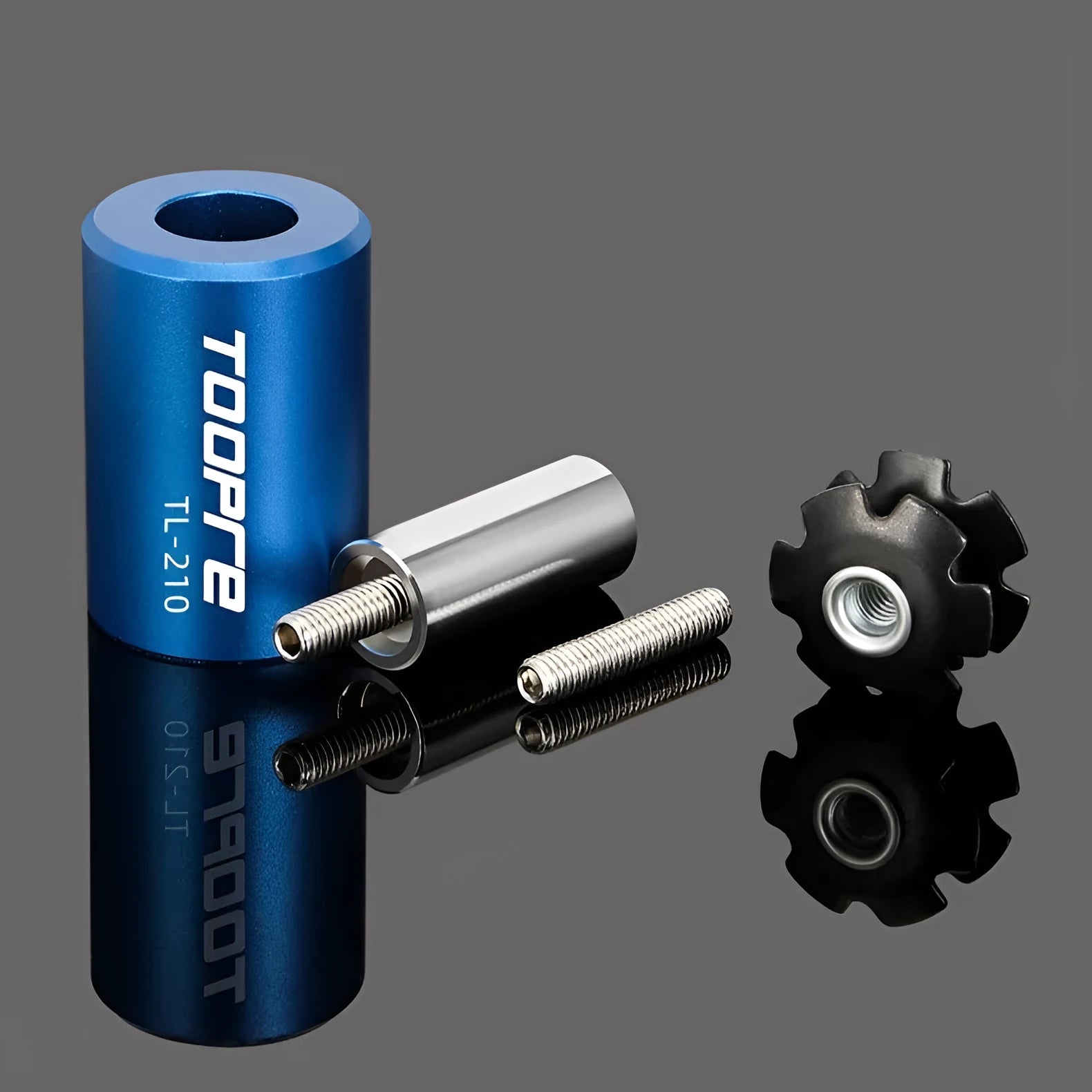 Blue sunflower driving tool for bicycle bowl group hanging core installation, made from aluminium alloy and stainless steel, on a workbench.