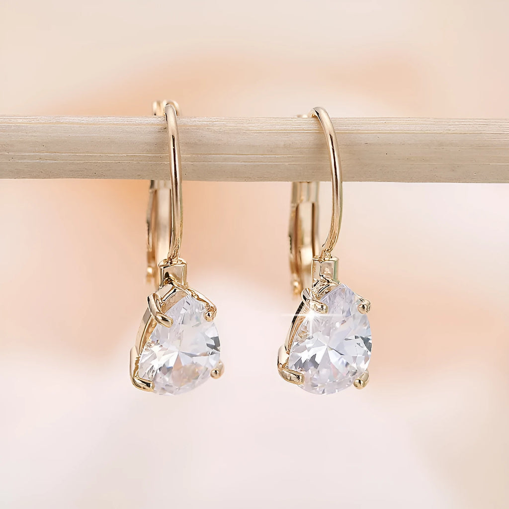 Drop-shaped women's fashion earrings with platinum inlaid gems in gold and platinum colour options