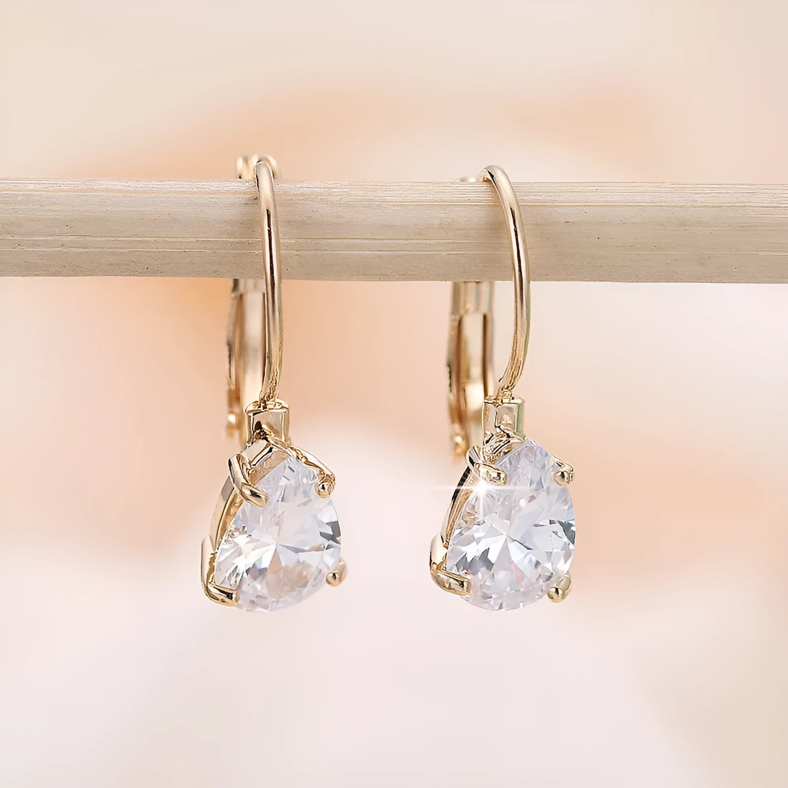 Drop-shaped women's fashion earrings with platinum inlaid gems in gold and platinum colour options