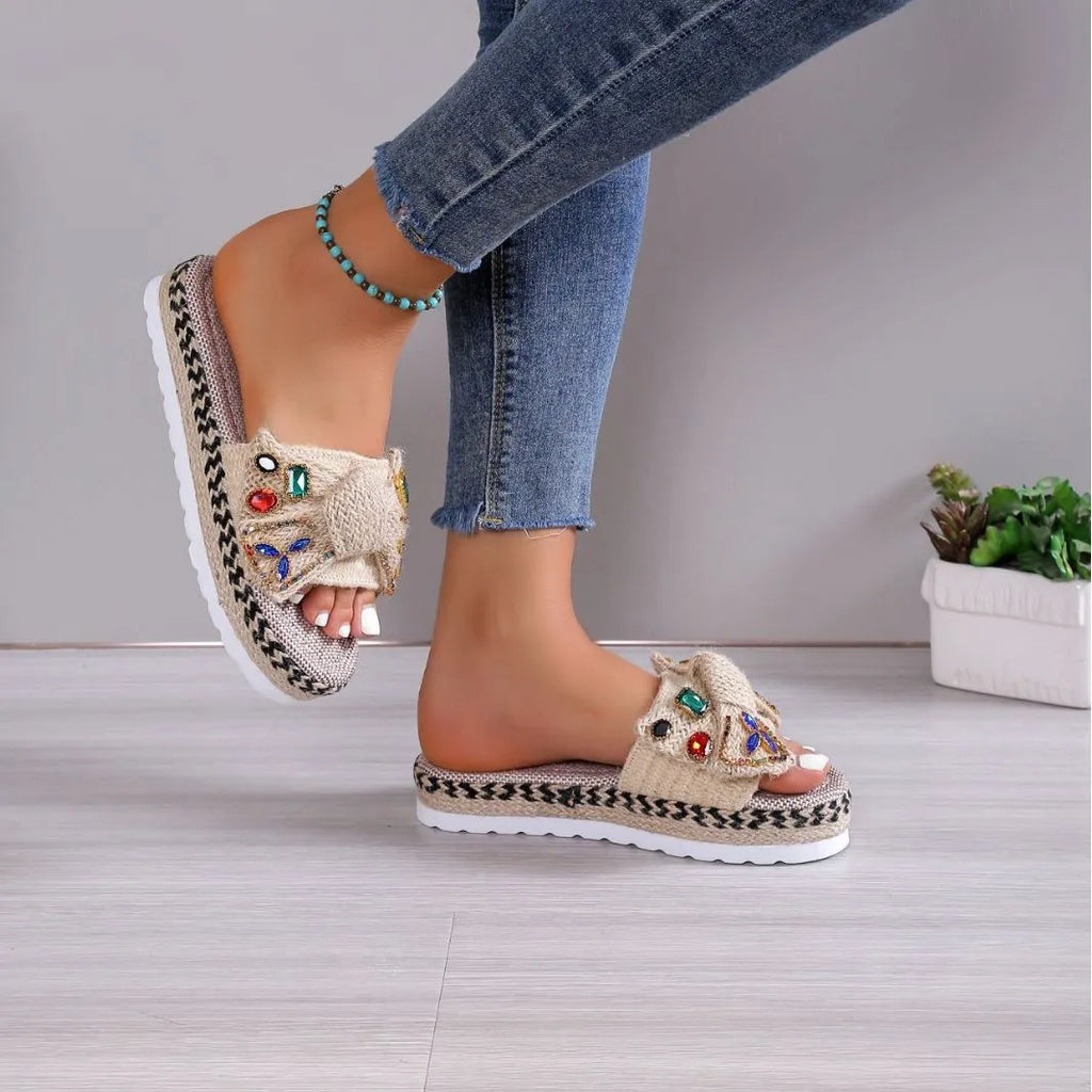 Beige women's platform sandals with bow detail, round toe, and cloth upper