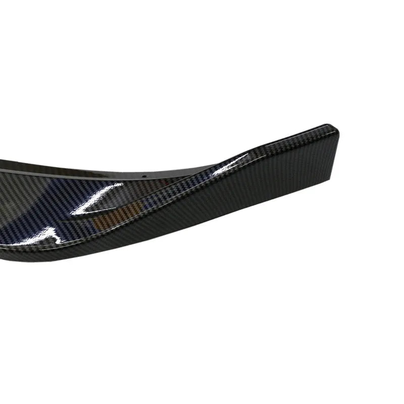 Audi A1 8X front splitter retrofit kit with three-section design in black Unksera pattern.