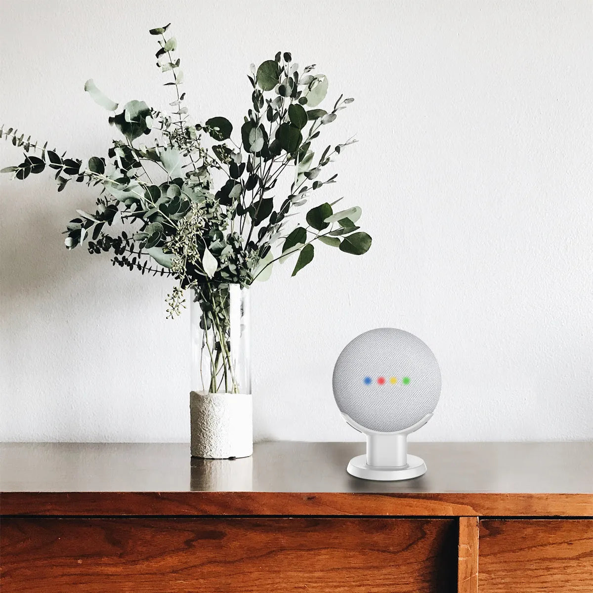 Compact plastic table holder stand for Google Home Mini in black colour with cable slot visible
