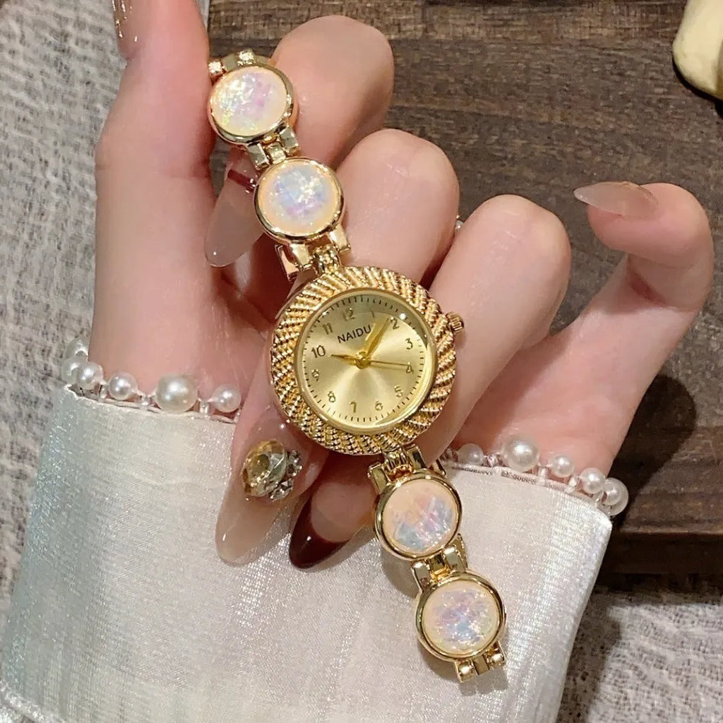 Women's round dial quartz watch in milky white with zinc alloy case and spiral crown.