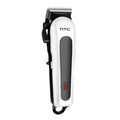 Black digital hair clipper with four plastic limiting combs and a bottle of oil on a white background.