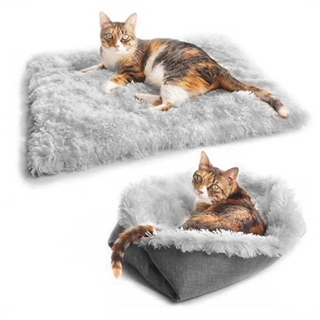 Two purpose gray pet blanket nest with long plush top and black non-slip bottom on a sofa