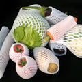 White foam net protective cover for fruit, shown next to an apple, with size options listed.