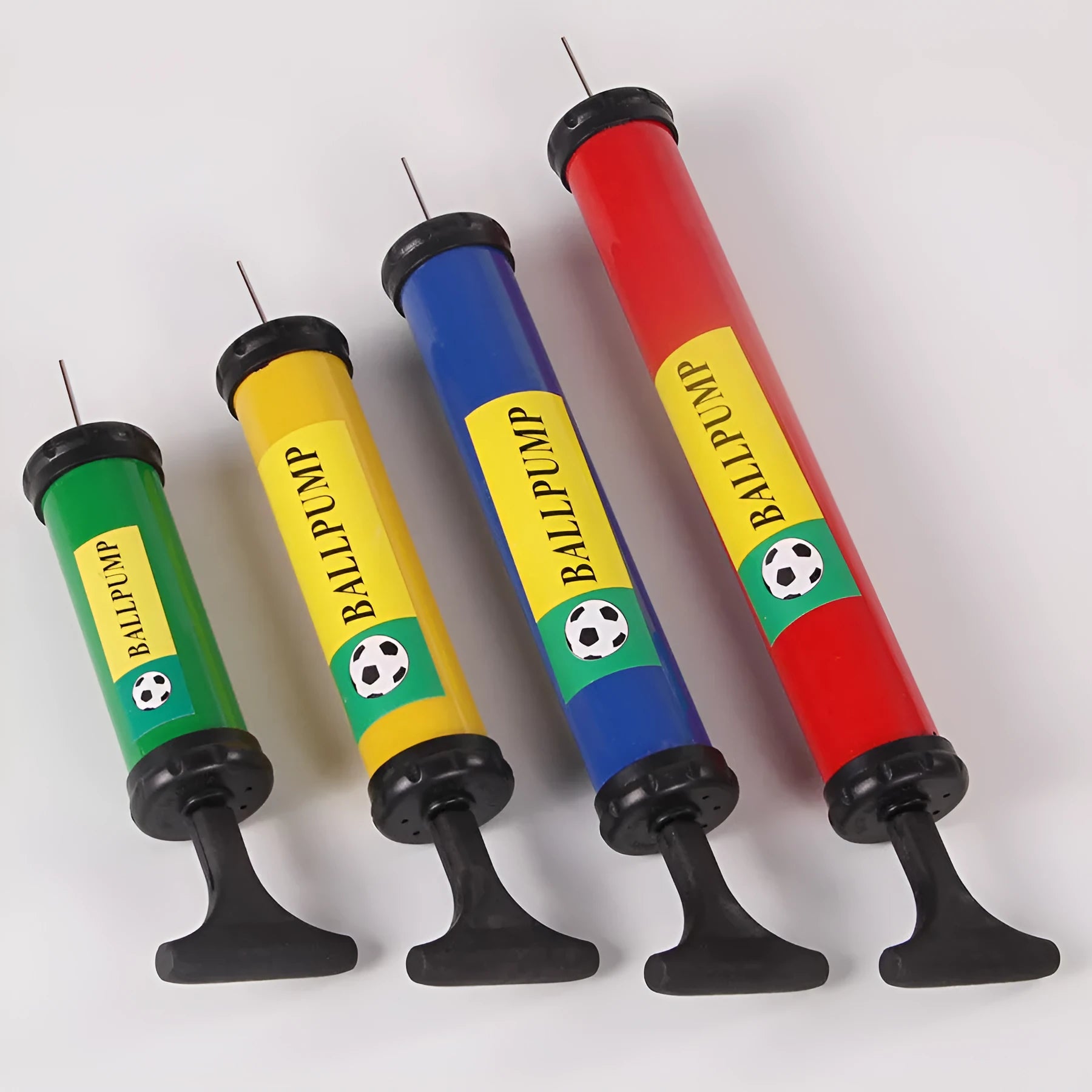 Plastic manual hand pump with nozzle adaptors for inflating sports balls and balloons.