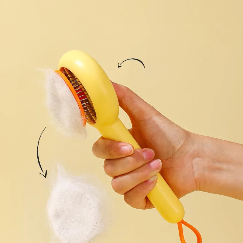 Small yellow duck pet grooming comb with fine needles and open section hair collection design