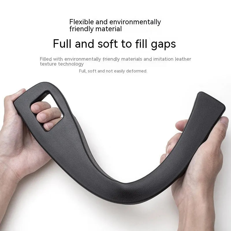 Black car seat gap storage box with handle between vehicle seats
