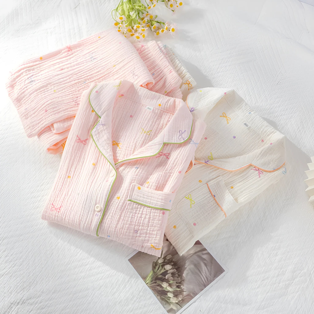 Women's long sleeve cotton pyjama set in pink, featuring a simple casual style top and trousers.