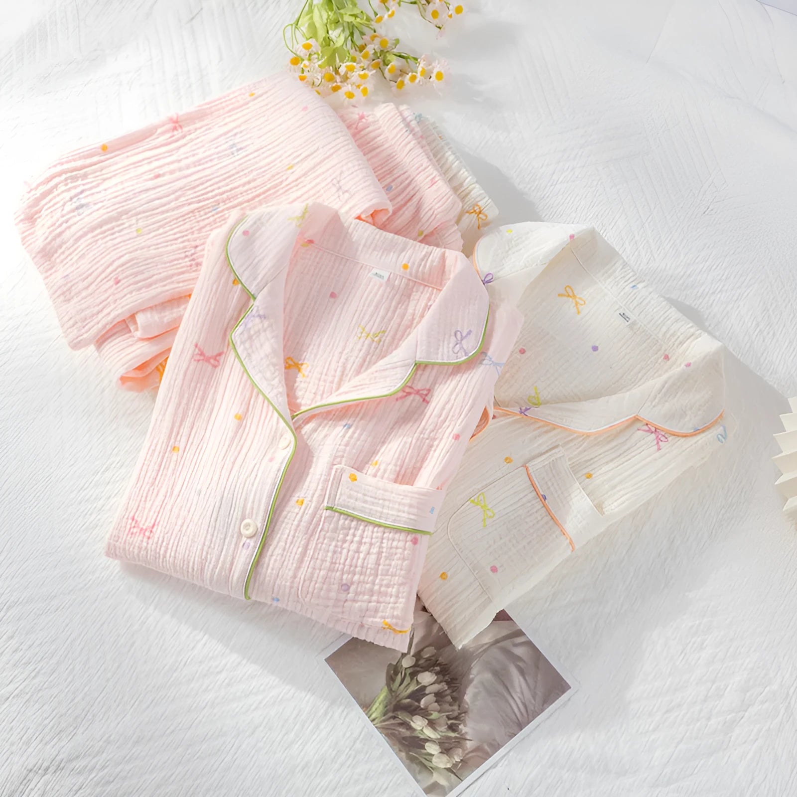 Women's long sleeve cotton pyjama set in pink, featuring a simple casual style top and trousers.