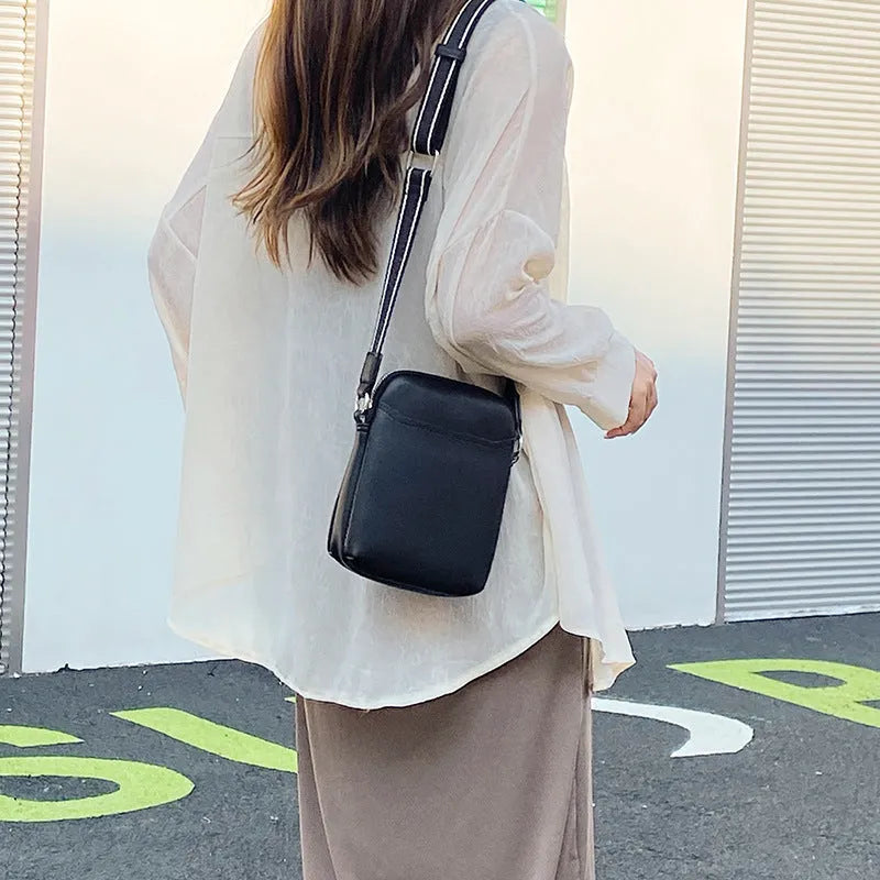 Solid colour PU leather small crossbody phone bag measuring 14.5cm by 5.5cm by 19cm