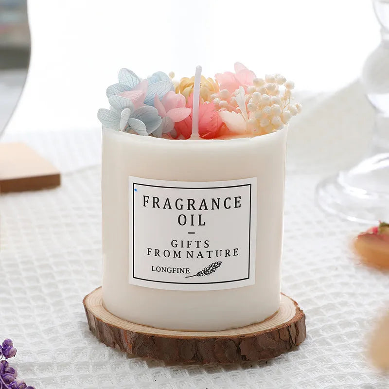 Aromatherapy candle with dried flowers on top, shown in various scent style options.