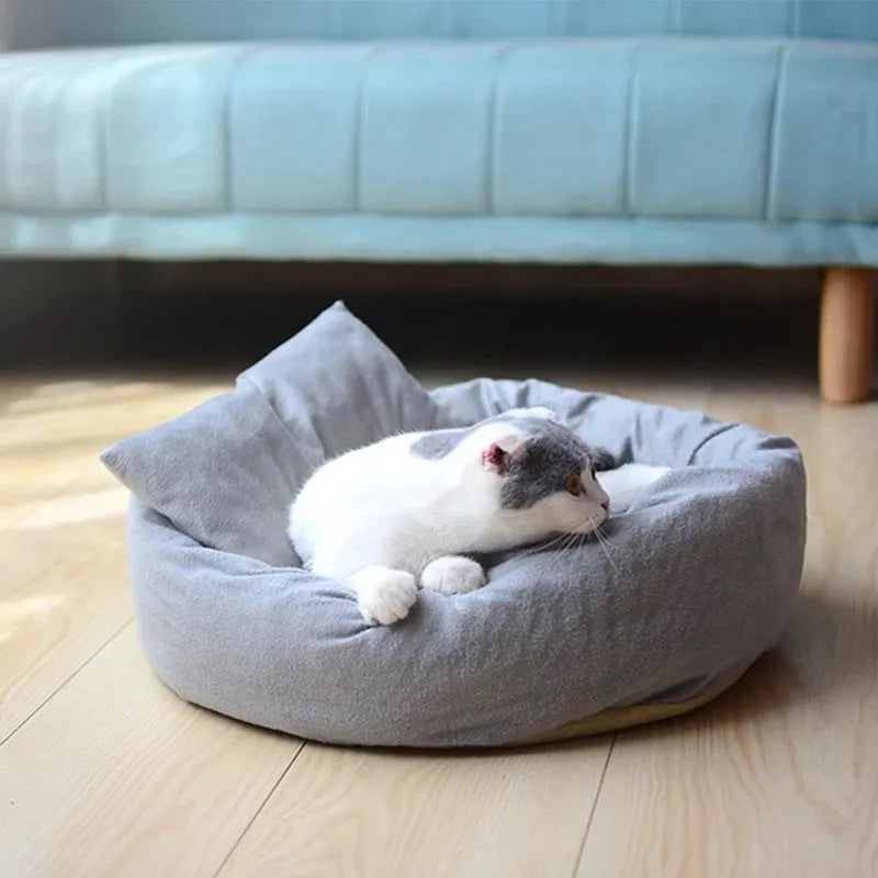 Gray round flannel pet bed for small dogs and cats with pillow on non-slip base