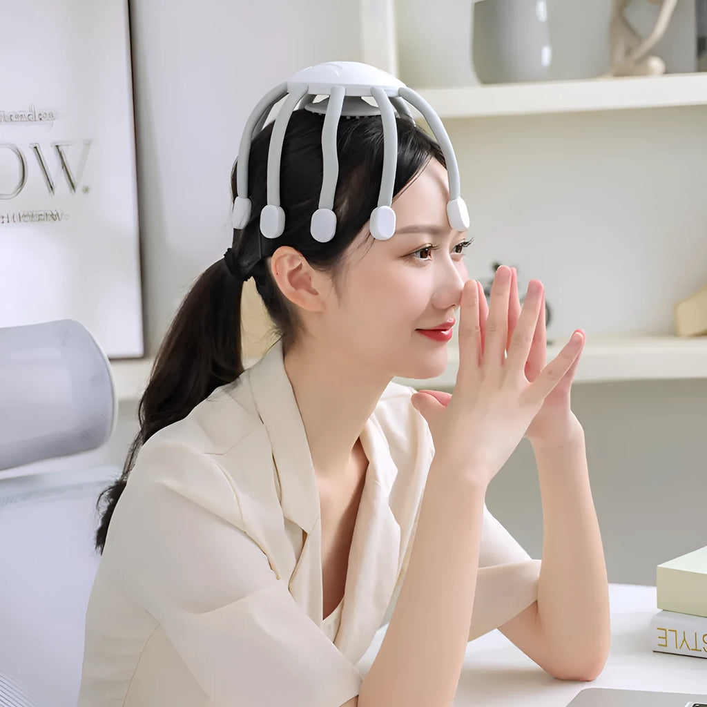 Black USB-powered electric head massager with multiple flexible claws on a white background.
