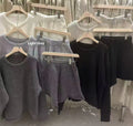 Women's loose-fitting long sleeve sweater and knitted wide-leg shorts co-ord set in dark grey.