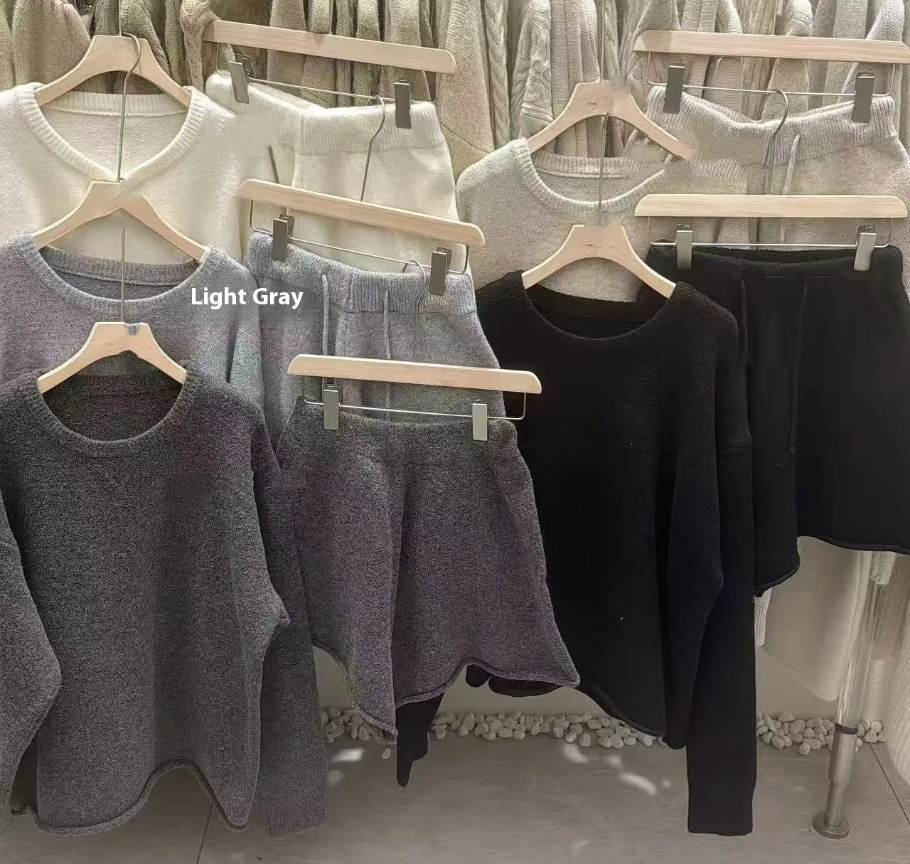 Women's loose-fitting long sleeve sweater and knitted wide-leg shorts co-ord set in dark grey.
