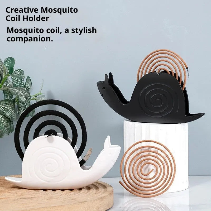 Plastic mosquito incense holder in black creative animal style on a table