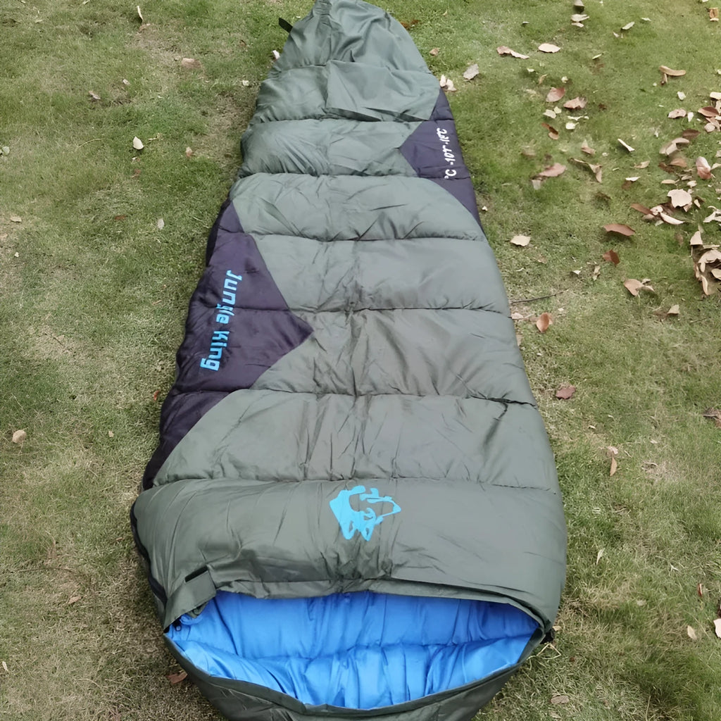 Mummy-style outdoor sleeping bag with compression storage bag in Army Green colour
