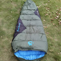 Mummy-style outdoor sleeping bag with compression storage bag in Army Green colour