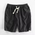 Breathable cotton linen blend straight-leg beach shorts in hemp colour with elastic waist, front view on white background