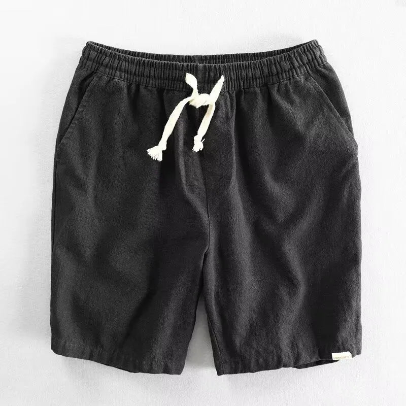 Breathable cotton linen blend straight-leg beach shorts in hemp colour with elastic waist, front view on white background