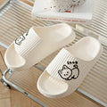 Green EVA platform slippers with a cat design on the upper, showing the thick non-slip sole.