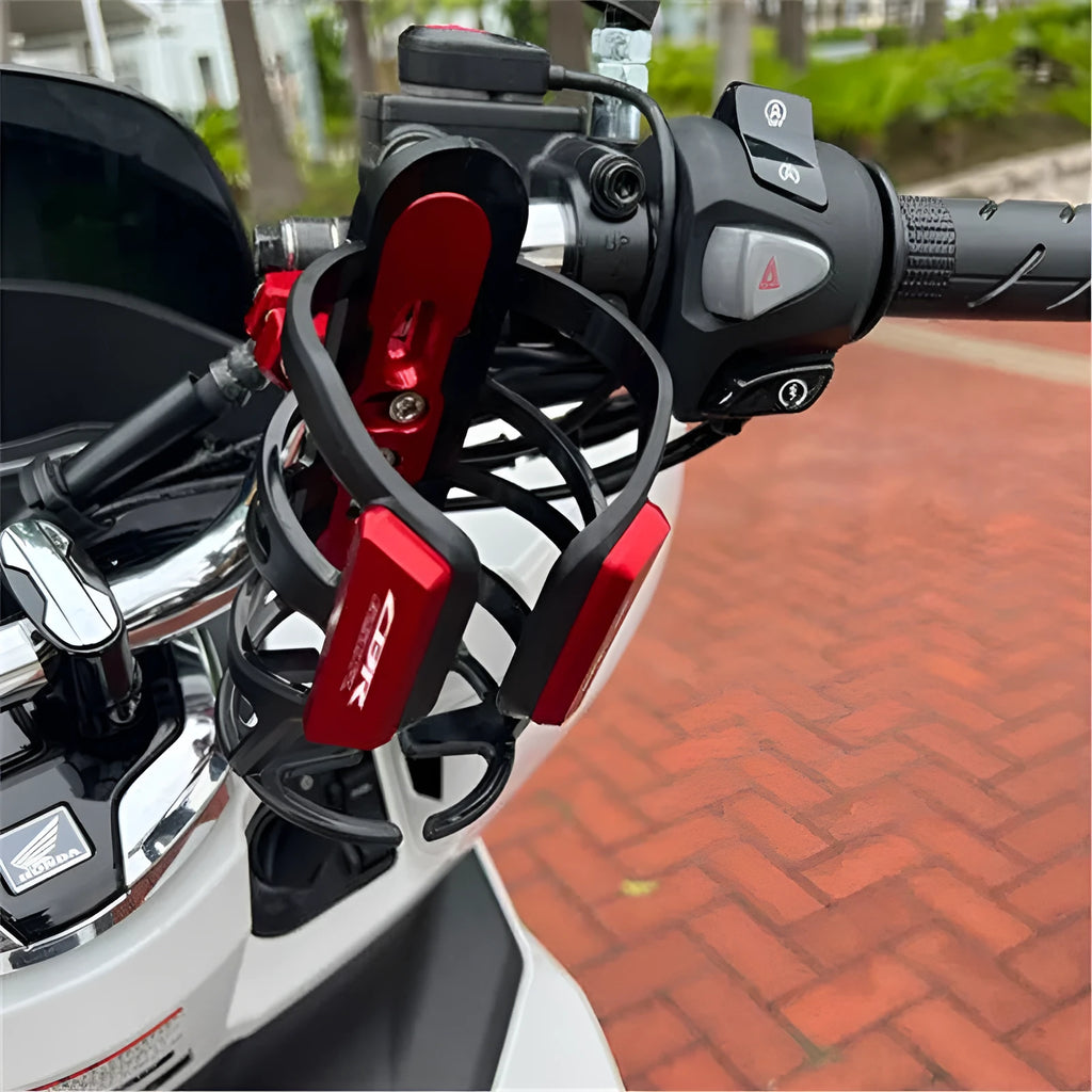 Water bottle cage mounted on Honda X-ADV scooter bumper in selected colour