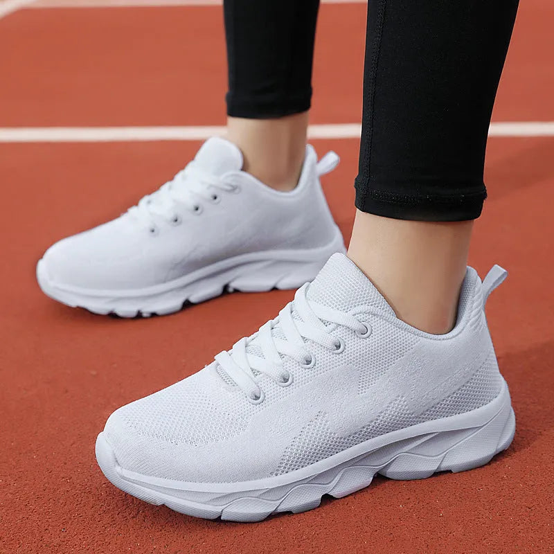 All black women's lightweight mesh sneakers with wedge heel and front lace-up design