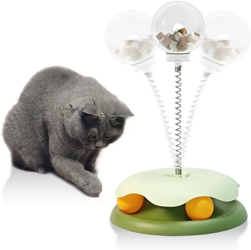 Blue and green PP plastic cat treat dispenser toy with track ball showing detachable components