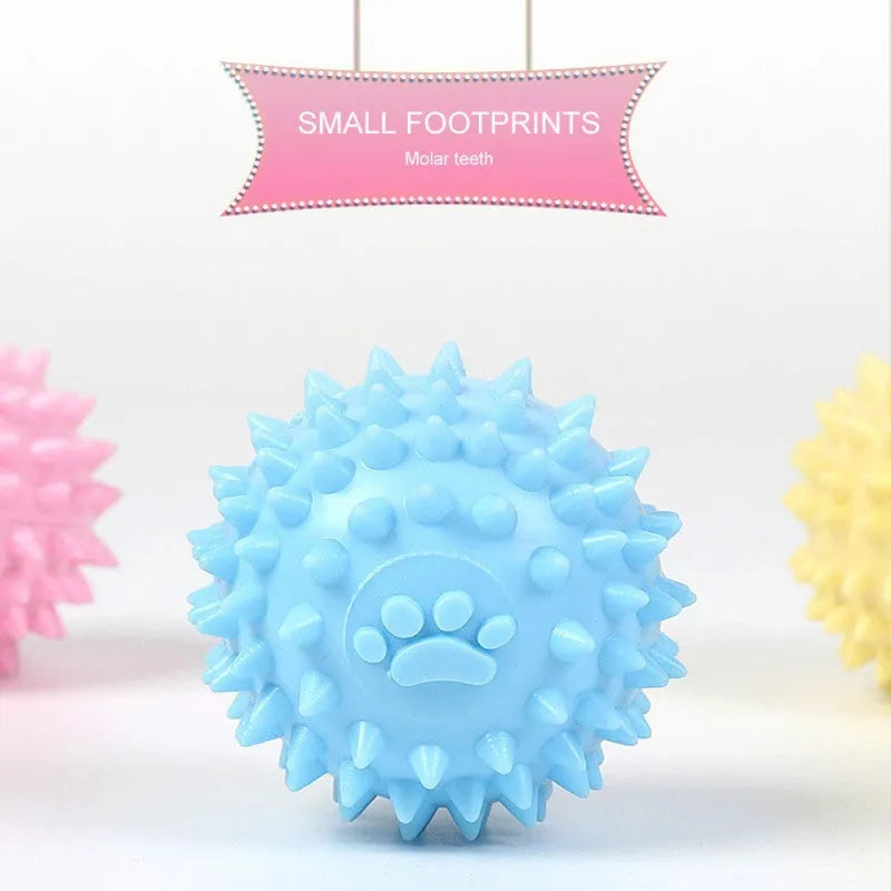 Blue TPR rubber dog chewing ball with textured footprint pattern for tooth cleaning
