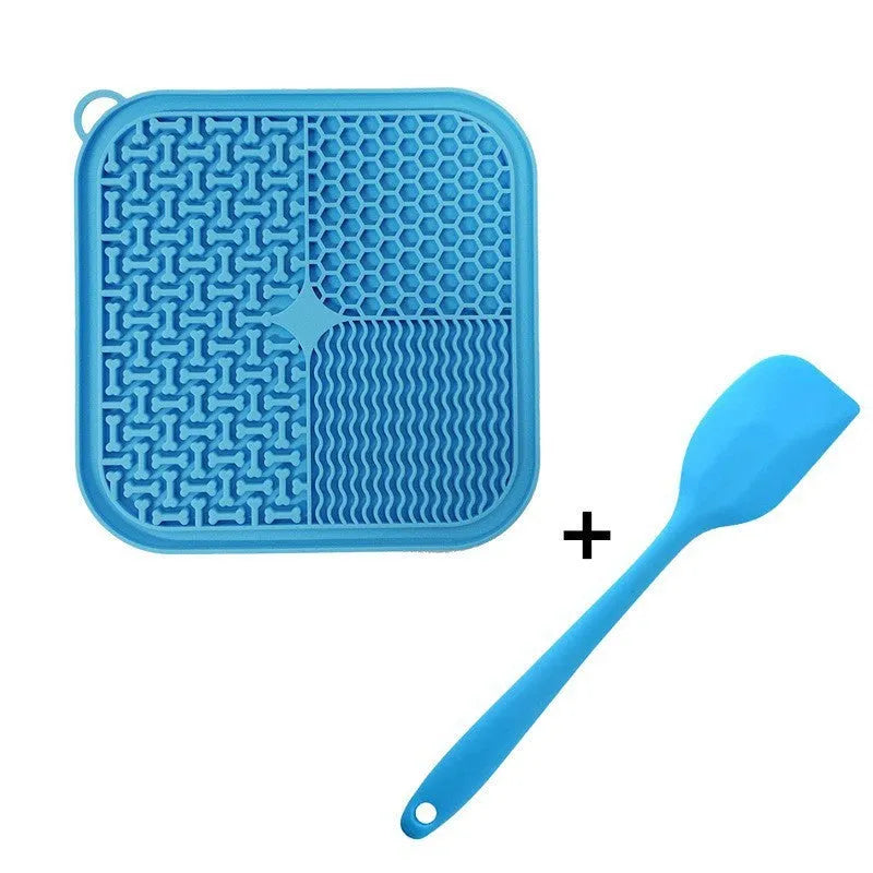 Blue silicone dog licking mat with textured surface and suction cups on back
