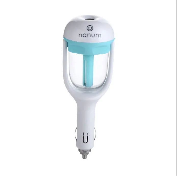 Compact blue car humidifier diffuser with rotating nozzle on a car dashboard